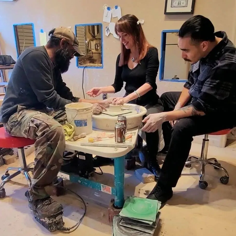 Jessi and Justin Baker, founders of CSRA Night & Day, at a pottery wheel